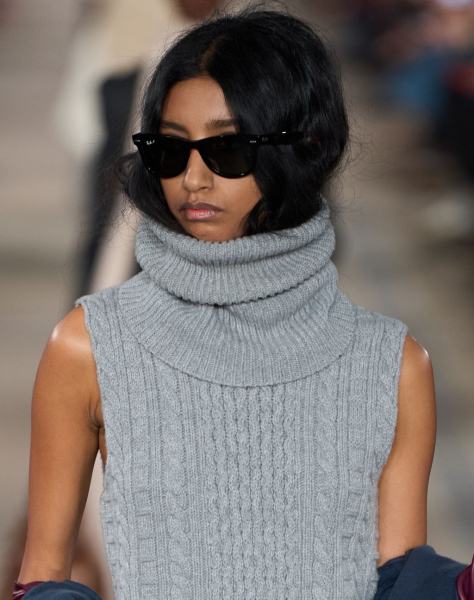 Image may contain Black Hair Hair Person Adult Clothing Knitwear and Sweater